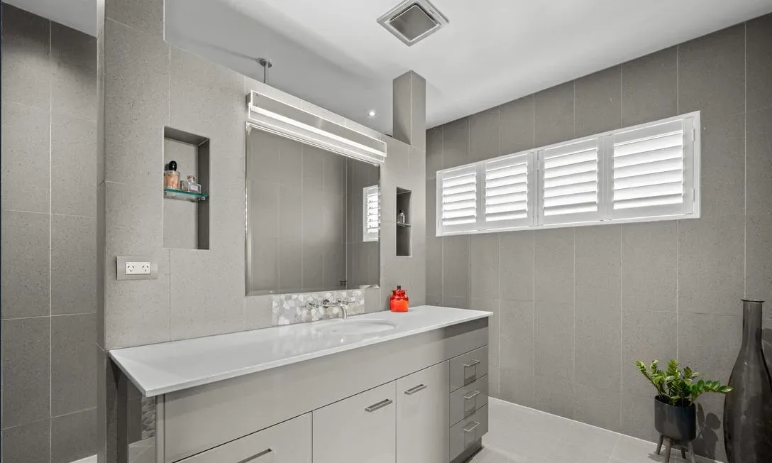 Renovated ensuite with walk-in shower and timber vanity