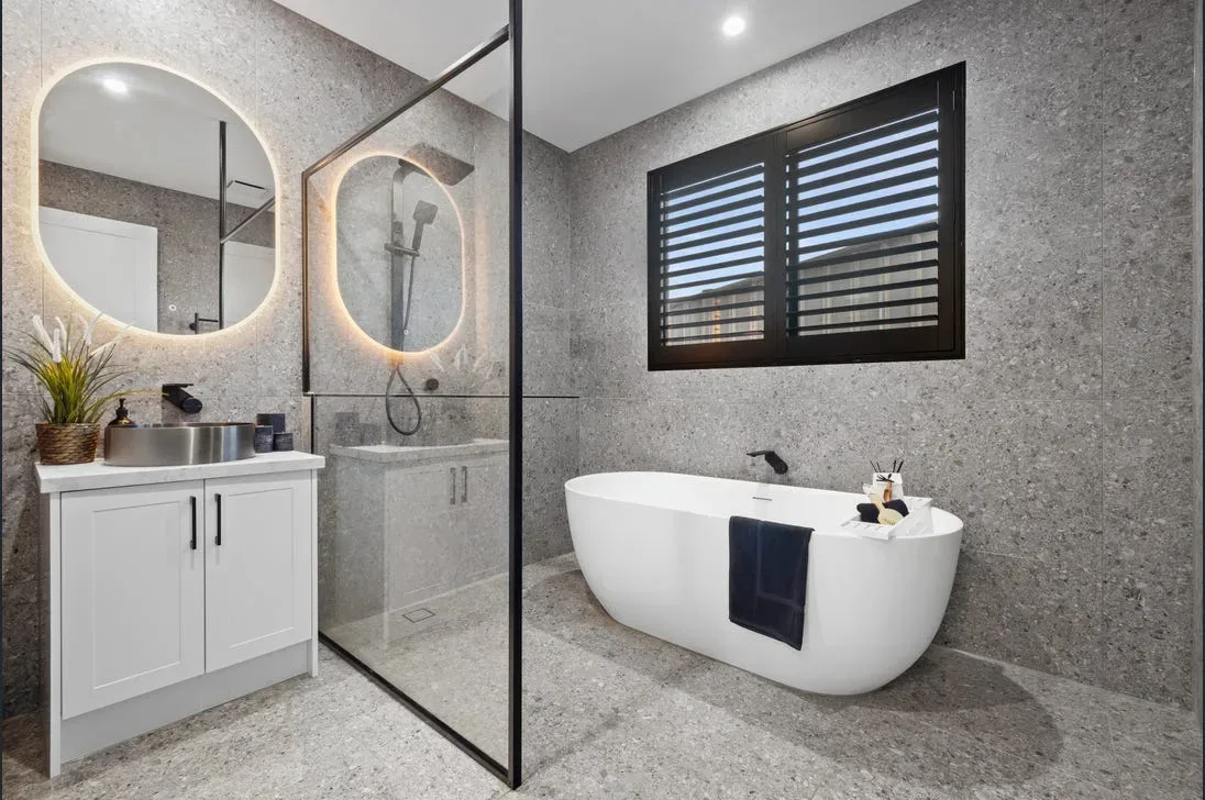 Spa-style bathroom with stone tiling and freestanding bath