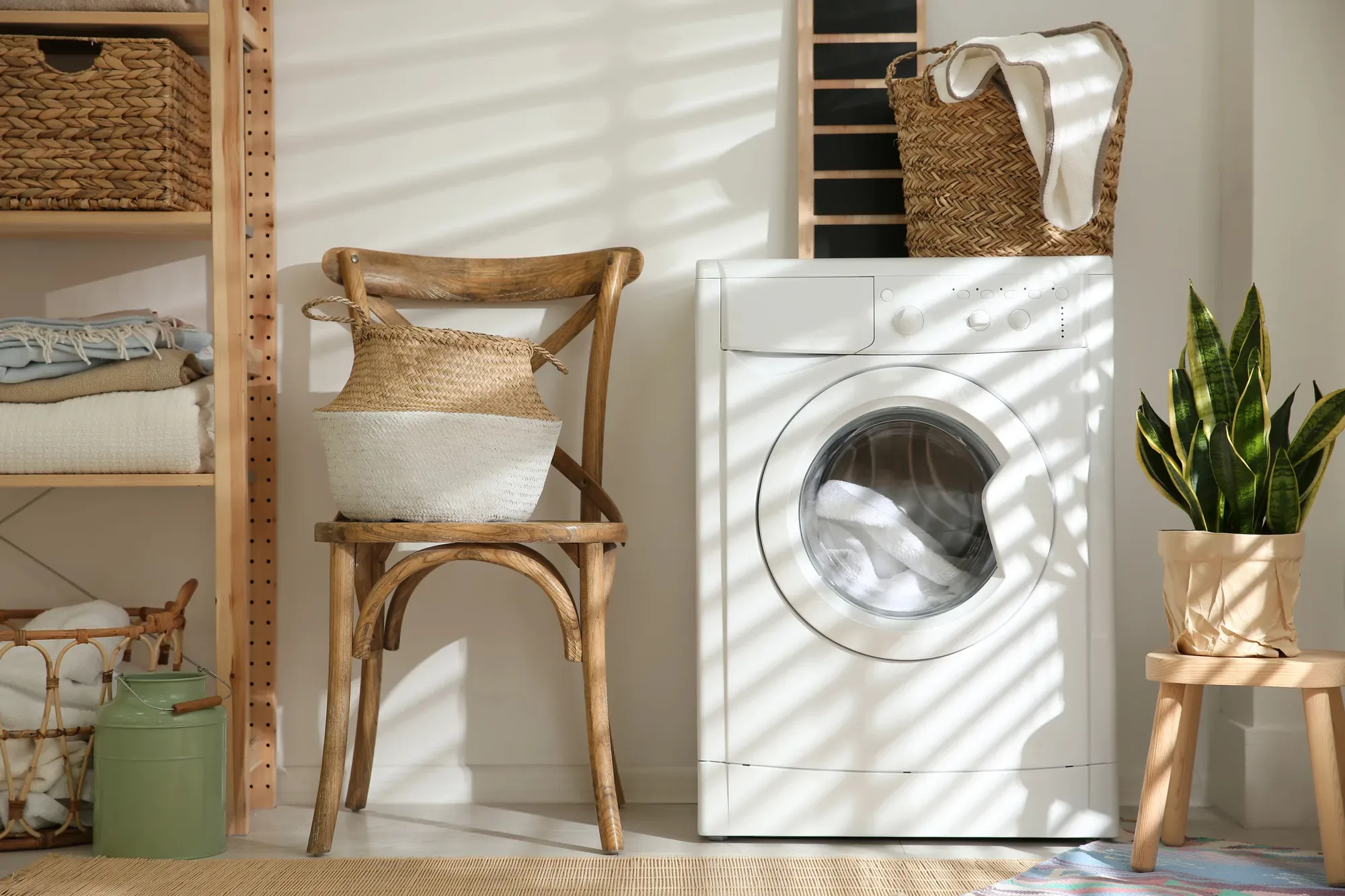 Laundry room with woven baskets and folded linen